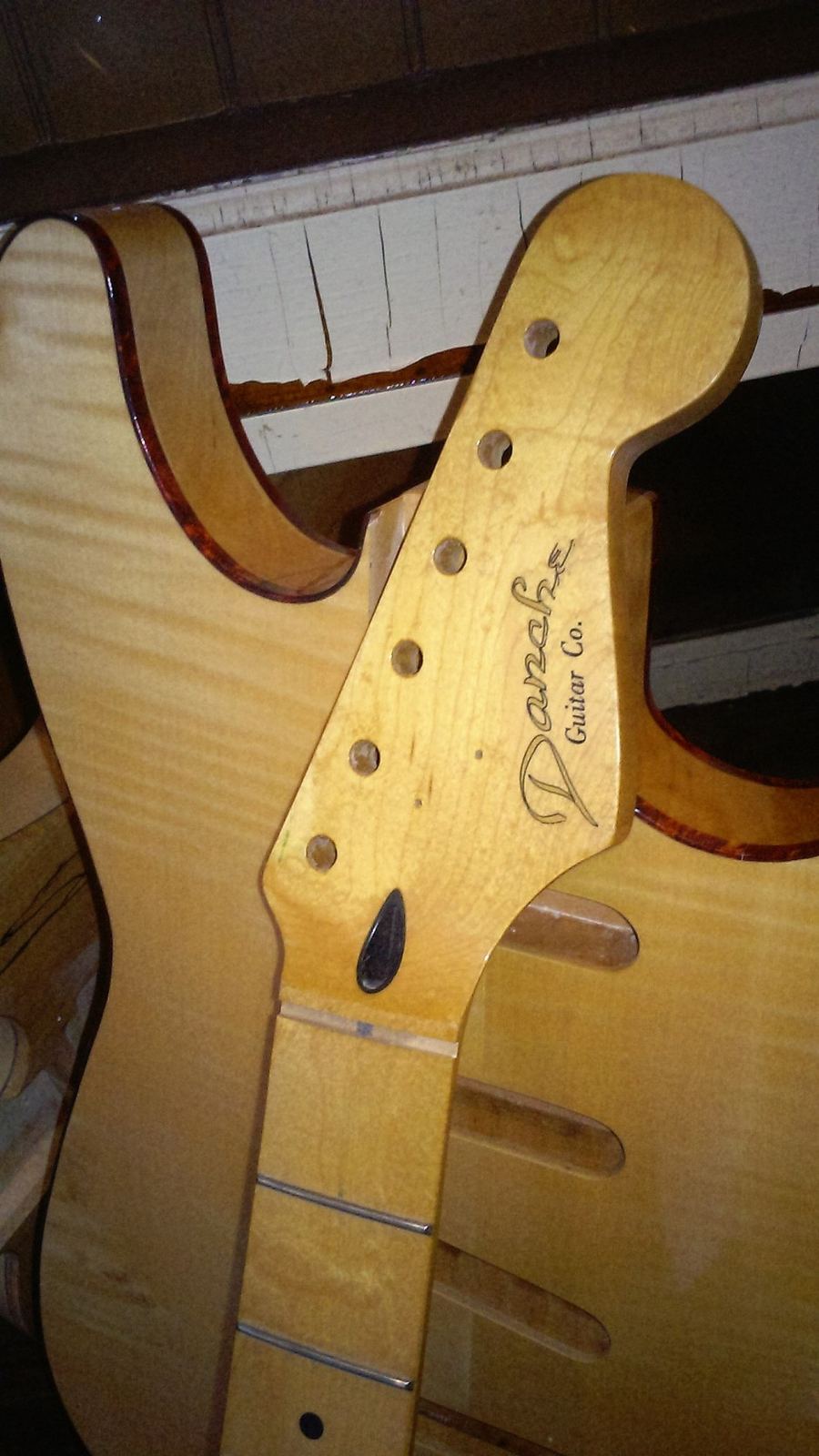 Handmade guitar neck and body waiting to be customized
