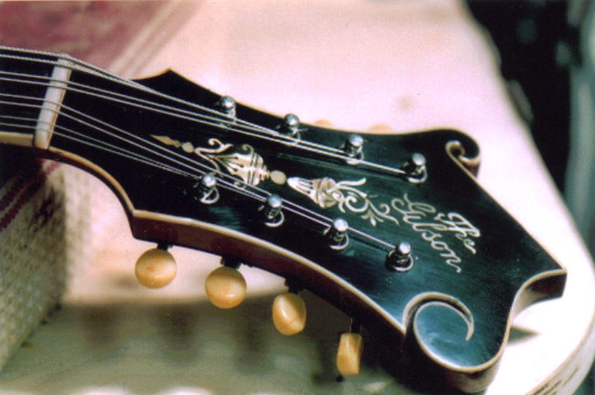 Restored mandolin headstock with ornate pearl inlay