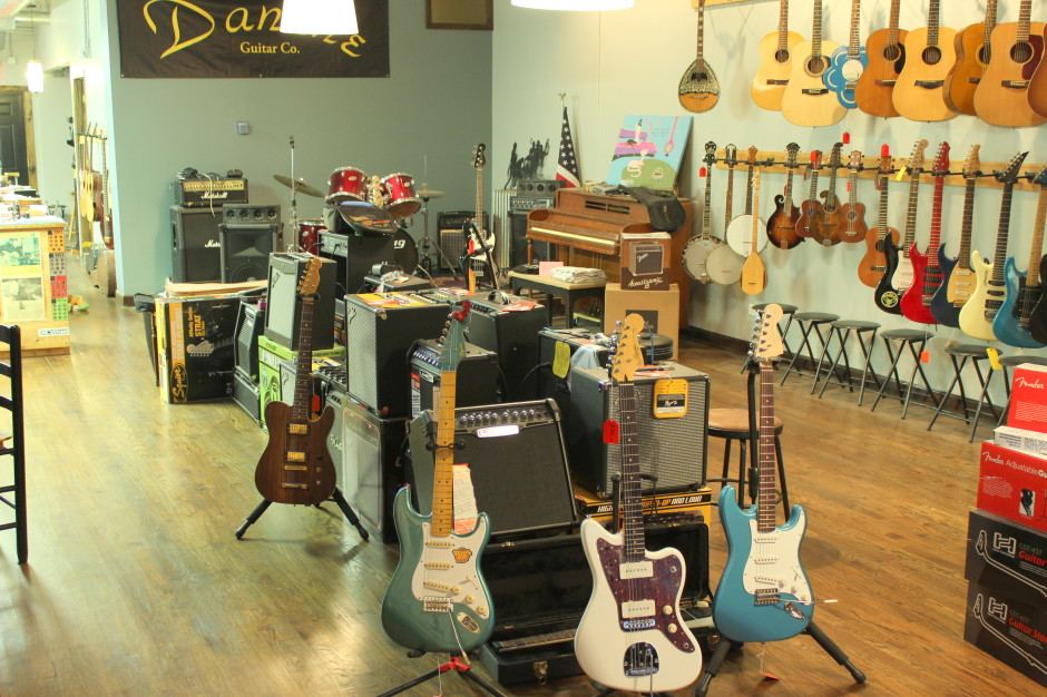 Amplifiers and guitars on the shop floor